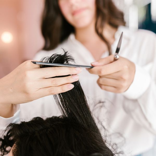Stylist cutting a client's hair