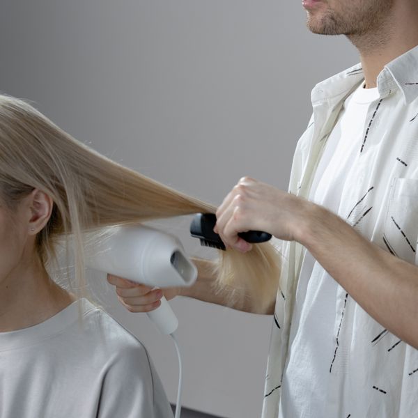 Blow-drying long blonde hair
