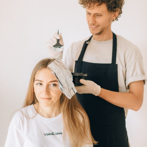 Applying colour to a client's hair